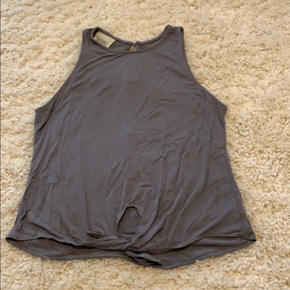 Tank top with tie at bottom